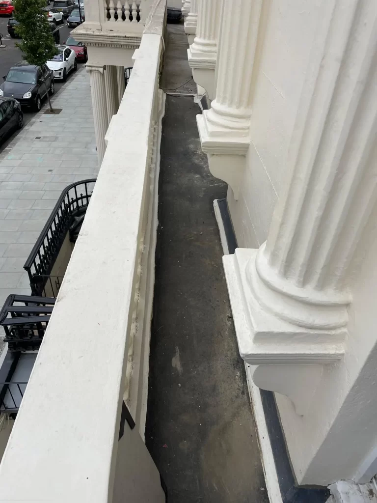 Repaired stucco balustrade and columns after external refurbishment